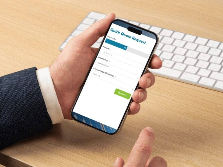 1-complete-form-770x433 Person submitting a quick quote request on a smartphone at desk.